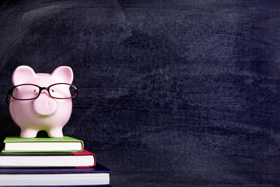 bigstock-Piggy-Bank-With-Glasses-And-Bl-117214469.jpg